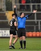 27 November 2016; Referee Sean Hurson issues James McClean of Kilcoo with a black card during the AIB Ulster GAA Football Senior Club Championship Final game between Slaughtneil and Kilcoo at the Athletic Grounds in Armagh. Photo by Oliver McVeigh/Sportsfile