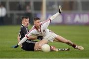 27 November 2016; Keelan Feeney of Slaughtneil in action against Martin Devlin of Kilcoo duriing the AIB Ulster GAA Football Senior Club Championship Final game between Slaughtneil and Kilcoo at the Athletic Grounds in Armagh. Photo by Oliver McVeigh/Sportsfile