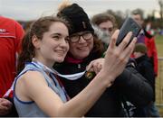 27 November 2016; Sophie Murphy, Dundrum South Dublin A.C., takes a selfie with her mother Mary Rutledge after winning the Junior Women's race during the Irish Life Health National Cross Country Championships at the National Sports Campus in Abbotstown, Co Dublin.  Photo by Cody Glenn/Sportsfile