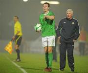 29 March 2011; Jonny Evans, Northern Ireland, takes a throw in as manager Nigel Worthington looks on. EURO2012 Championship Qualifier, Northern Ireland v Slovenia, Windsor Park, Belfast, Co. Antrim. Picture credit: Oliver McVeigh / SPORTSFILE