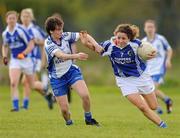 17 April 2011; Jane Moore, Laois, in action against Cora Courtney, Monaghan. Bord Gais Energy National Football League, Division One, Semi-Final, Monaghan v Laois, Ballymahon, Longford. Photo by Sportsfile