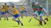 17 April 2011; Peter Kellehan, Roscommon, in action against Stephen Broderick and Brian Hunt, right, Mayo.  Allianz GAA Hurling Division 3B Final, Mayo v Roscommon, Carrick-on-Shannon, Leitrim. Picture credit: Ray Ryan / SPORTSFILE