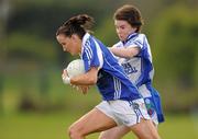 17 April 2011; Tracey Lawlor, Laois, in action against Cora Courtney, Monaghan. Bord Gais Energy National Football League, Division One, Semi-Final, Monaghan v Laois, Ballymahon, Longford. Photo by Sportsfile