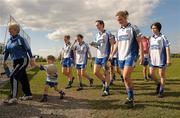 17 April 2011; Dejected Monaghan players walk off the pitch after the game. Bord Gais Energy National Football League, Division One, Semi-Final, Monaghan v Laois, Ballymahon, Longford. Photo by Sportsfile