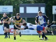 17 April 2011; Aaron Carroll, Young Munster, is tackled by Peter O'Mahony, Cork Constitution. Ulster Bank League, Division 1, Semi-Final, Cork Constitution v Young Munster, Temple Hill, Cork. Picture credit: Ken Sutton / SPORTSFILE