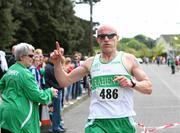 17 April 2011; Damien Kelly, Raheny Shamrocks A.C, crosses the line to win the Master Mens Road Relay. Woodie’s DIY Road Relay Championships of Ireland. Raheny, Dublin. Picture credit: Tomas Greally / SPORTSFILE