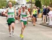 17 April 2011; Mick Traynor, Raheny Shamrocks A.C, hands over to teammate Damien Kelly for the final leg during the Master Mens Road Relay. Woodie’s DIY Road Relay Championships of Ireland. Raheny, Dublin. Picture credit: Tomas Greally / SPORTSFILE