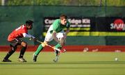 17 April 2011; Ronan Flannery, Ireland, in action against Keegan Perira, Canada. Men's Hockey Test Series, Ireland v Canada, National Hockey Stadium, UCD, Belfield, Dublin. Picture credit: Barry Cregg / SPORTSFILE