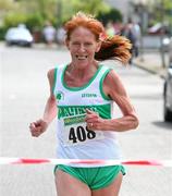 17 April 2011; Anne Reede, Raheny Shamrocks A.C, aproaches the line to win the Master Womens Over 50 Road Relay. Woodie’s DIY Road Relay Championships of Ireland. Raheny, Dublin. Picture credit: Tomas Greally / SPORTSFILE