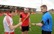 17 April 2011; Referee Owen Elliott with Tyrone captain Sean Paul Begley, left, and South Down captain Eoin McGuinness, centre, during the coin toss. Allianz GAA Hurling Division 4 Final, South Down v Tyrone, Athletic Grounds, Armagh. Picture credit: Oliver McVeigh / SPORTSFILE