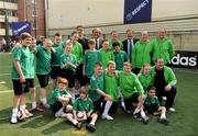19 April 2011; UEFA President Michel Platini with Ronnie Whelan, UEL Final Ambassador, Anto Reilly, Hardwicke F.C., players and officials after he visited the club's facilities and the Football for All Programme while in Dublin for the UEFA Europa League Trophy Handover in advance of the UEFA Europa League final, to be played at the Aviva Stadium on Wednesday 18 May. Hardwicke Street, Dublin. Picture credit: Ray McManus / SPORTSFILE