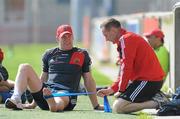 19 April 2011; Munster's Paul O'Connell receives treatment from Ian Costello during squad training ahead of their Celtic League game against Ospreys on Saturday. Munster Rugby Squad Training, Thomond Park, Limerick. Picture credit: Diarmuid Greene / SPORTSFILE