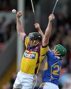 17 April 2011; Darren Stamp, Wexford, in action against John O'Neill, Tipperary. Allianz Hurling League, Division 1, Round 7, Tipperary v Wexford, Semple Stadium, Thurles, Co. Tipperary. Picture credit: Brian Lawless / SPORTSFILE