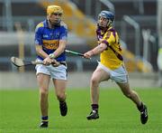 17 April 2011; David Young, Tipperary, in action against Brendan Doyle, Wexford. Allianz Hurling League, Division 1, Round 7, Tipperary v Wexford, Semple Stadium, Thurles, Co. Tipperary. Picture credit: Brian Lawless / SPORTSFILE