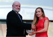 30 November 2016; Michelle Finn, University of Limerick, is presented with the University Athlete of the Year award by Cyril Smyth, Trinity College, at the Irish Life Health National Athletics Awards 2016 at the Crowne Plaza Hotel in Santry, Dublin. Photo by Seb Daly/Sportsfile