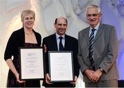 30 November 2016; Hayley and Drew Harrison, left, and centre, are presented with the European Athletics Coaching award by Eamon Harvey, right, Chair of Coaching and Development, at the Irish Life Health National Athletics Awards 2016 at the Crowne Plaza Hotel in Santry, Dublin. Photo by Seb Daly/Sportsfile