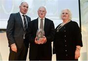 30 November 2016; Donie Walsh, Leevale AC, is presented with the Services to Coaching award by Jim Dowdall, Managing Director at Irish Life Health, left, and Georgina Drumm, President of Athletics Ireland, right, at the Irish Life Health National Athletics Awards 2016 at the Crowne Plaza Hotel in Santry, Dublin. Photo by Seb Daly/Sportsfile