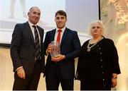 30 November 2016; Adam King, centre, is presented with his U20 Athlete of the Year award by Jim Dowdall, Managing Director at Irish Life Health, left, and Georgina Drumm, President of Athletics Ireland, right, at the Irish Life Health National Athletics Awards 2016 at the Crowne Plaza Hotel in Santry, Dublin. Photo by Seb Daly/Sportsfile