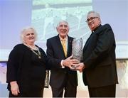 30 November 2016; Ronnie Delany, centre, is presented with an award after being honoured on the 60th anniversairy of his gold medal in the 1500m at the 1956 Summer Olympics, by Georgina Drumm, President of Athletics Ireland, left, and Rev. Peter Donohue, right, at the Irish Life Health National Athletics Awards 2016 at the Crowne Plaza Hotel in Santry, Dublin. Photo by Seb Daly/Sportsfile