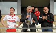 17 April 2011; President of the Ulster Council Aogan Farrell, centre, speaking alongside Tyrone captain Sean Paul Begley, left, and Tyrone County Board Chairman Ciaran McLaughlin before the presentation cup presentation. Allianz GAA Hurling Division 4 Final, South Down v Tyrone, Athletic Grounds, Armagh. Picture credit: Oliver McVeigh / SPORTSFILE