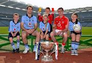 20 April 2011; Pictured at the Allianz Football Division 1 & 2 Finals Preview are Cork's Donncha O'Connor and Dublin's Bryan Cullen with Cumann na mBunscoil players Patrick Bridgeman, left, Niamh Cummins, centre, Ciaran Brennan, referee, and Amy Cummins, all from Holy Trinity National School, Donaghmeade, Co. Dublin. Croke Park, Dublin. Picture credit: David Maher / SPORTSFILE
