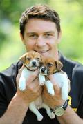 20 April 2011; Pictured at the launch of the 2011 Pedigree Adoption Drive is dog lover, Munster and Ireland rugby star David Wallace with his friends Jack Russell pups Zena, left, and Tia, from the ISPCA. 45 dogs are abandoned in Ireland every day, 17 dogs are put to sleep. In order to help curb these startling figures, Pedigree has teamed up David and Aoibhinn for the 2011 Annual Pedigree Adoption Drive. St. Stephen's Green, Dublin. Picture credit: Brian Lawless / SPORTSFILE