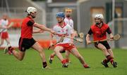 17 April 2011; Justin Kelly, Tyrone, in action against Paul O'Neill and Paul McAleenan, South Down. Allianz GAA Hurling Division 4 Final, South Down v Tyrone, Athletic Grounds, Armagh. Picture credit: Oliver McVeigh / SPORTSFILE