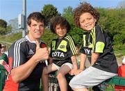 21 April 2011; Munster's Donncha O'Callaghan with five year old Diran and eight year old Conor Oresanya, from Beaumont, in Cork City, after squad training ahead of their Celtic League match against Ospreys on Saturday. Munster Rugby Squad Training, CIT Bishopstown, Cork. Picture credit: Matt Browne / SPORTSFILE