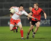 16 March 2011; Matthew Donnelly, Tyrone, in action against Michael Higgins, Down. Cadbury Ulster GAA Football Under 21 Championship Quarter-Final, Down v Tyrone, Pairc Esler, Newry, Co. Down. Picture credit: Oliver McVeigh / SPORTSFILE