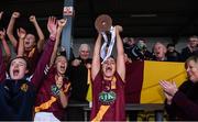 3 December 2016; St. Maurs captain Eadaoinn McGuinness lifts the cup as her team-mates celebrate after the All Ireland Junior Club Championship Final 2016 match between Kinsale and St. Maurs at Dr Cullen Park in Carlow. Photo by Matt Browne/Sportsfile