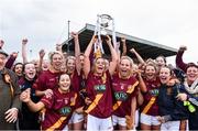 3 December 2016; St. Maurs captain Eadaoinn McGuinness lifts the cup as her team-mates celebrate after the All Ireland Junior Club Championship Final 2016 match between Kinsale and St. Maurs at Dr Cullen Park in Carlow. Photo by Matt Browne/Sportsfile