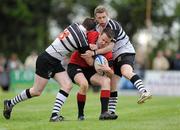 24 April 2011; Colin Hughes, Tullamore RFC, is tackled by Chris Scully and Stephen Murphy, right, Dundalk RFC. Newstalk Provincial Towns Cup Final, Dundalk RFC v Tullamore RFC, Edenderry RFC, Coolavacoose, Carbury, Co. Kildare. Picture credit: Barry Cregg / SPORTSFILE