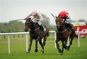 25 April 2011; Voler La Vedette, right, with Andrew Lynch up, on their way to winning the Keelings Irish Strawberry Hurdle from Blacktairmountain, with Ruby Walsh up.  Fairyhouse Easter Festival, Fairyhouse Racecourse, Fairyhouse, Co. Meath. Picture credit: Ray McManus / SPORTSFILE