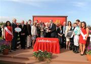 25 April 2011; Minister for Agricultue, Food & Marine Simon Convey, T.D., presents Grace Dunlop with the cup following Organisedconfusion's victory in the Ladbrokes Irish Grand National Steeplechase, also included are trainer Arthur Moore, left, and jockey Nina Carberry. Fairyhouse Easter Festival, Fairyhouse Racecourse, Fairyhouse, Co. Meath. Picture credit: Stephen McCarthy / SPORTSFILE