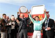 25 April 2011; Owner Grace Dunlop, trainer Arthur Moore and jockey Nina Carberry celebrate after winning the Ladbrokes Irish Grand National Steeplechase with Organisedconfusion. Fairyhouse Easter Festival, Fairyhouse Racecourse, Fairyhouse, Co. Meath. Picture credit: Stephen McCarthy / SPORTSFILE