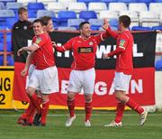 25 April 2011; Philip Hughes, second from right, Shelbourne, celebrates after scoring his side's second goal with team-mates, left to right, Karl Birmingham, Stephen Paisley and John Sullivan. EA Sports Cup, 2nd Round, Pool 4, Shelbourne v Bohemians, Tolka Park, Drumcondra, Dublin. Picture credit: David Maher / SPORTSFILE