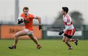 4 December 2016; Oisín O'Neill of Armagh in action against Niall Keenan of Derry during the O'Fiaich Cup Semi-Final match between Armagh and Derry at St Oliver Plunkett Park in Crossmaglen, Co Armagh. Photo by Piaras Ó Mídheach/Sportsfile
