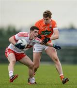 4 December 2016; Conor McGrogan of Derry in action against Oisín O'Neill of Armagh during the O'Fiaich Cup Semi-Final match between Armagh and Derry at St Oliver Plunkett Park in Crossmaglen, Co Armagh. Photo by Piaras Ó Mídheach/Sportsfile