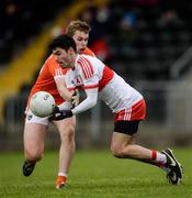 4 December 2016; Niall Keenan of Derry in action against Oisín O'Neill of Armagh during the O'Fiaich Cup Semi-Final match between Armagh and Derry at St Oliver Plunkett Park in Crossmaglen, Co Armagh. Photo by Piaras Ó Mídheach/Sportsfile