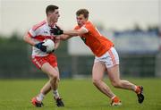 4 December 2016; Conor McGrogan of Derry in action against Oisín O'Neill of Armagh during the O'Fiaich Cup Semi-Final match between Armagh and Derry at St Oliver Plunkett Park in Crossmaglen, Co Armagh. Photo by Piaras Ó Mídheach/Sportsfile