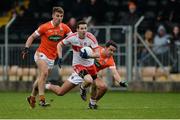4 December 2016; Niall McLoughlin of Derry in action against Shea Heffron, left, and Stefan Campbell of Armagh during the O'Fiaich Cup Semi-Final match between Armagh and Derry at St Oliver Plunkett Park in Crossmaglen, Co Armagh. Photo by Piaras Ó Mídheach/Sportsfile