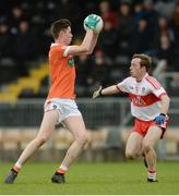 4 December 2016; Ben Crealey of Armagh in action against Neil Forester of Derry during the O'Fiach Cup Semi-Final match between Armagh and Derry at St Oliver Plunkett Park in Crossmaglen, Co Armagh. Photo by Piaras Ó Mídheach/Sportsfile
