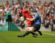 30 April 2011; Jean-Marc Doussain, Toulouse, is tackled by Kevin McLaughlin, Leinster. Heineken Cup Semi-Final, Leinster v Toulouse, Aviva Stadium, Lansdowne Road, Dublin. Picture credit: Stephen McCarthy / SPORTSFILE