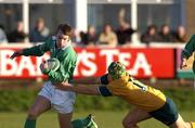 22 December 2001; Tomas O'Leary of Ireland is tackled by Drew Mitchell of Australia during the International Schools Friendly match between Ireland and Australia at Temple Hill in Cork. Photo by Matt Browne/Sportsfile