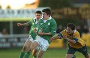 22 December 2001; John Hearty of Ireland is tackled by Junior Hunt of Australia during the International Schools Friendly match between Ireland and Australia at Temple Hill in Cork. Photo by Matt Browne/Sportsfile