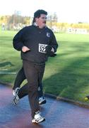 25 December 2001; Chief Executive of Waterford Crystal John Foley during a Christmas Day Goal Miles Run at Belfield Park in Dublin. Photo by Ray McManus/Sportsfile