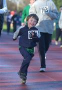 25 December 2001; Six year old Maurice Joy from Mount Merrion in Dublin during a Christmas Day Goal Miles Run at Belfield Park in Dublin. Photo by Ray McManus/Sportsfile
