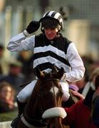 26 December 2001; Jockey Barry Geraghty celebrates on Moscow Flyer as he arrives in the winners enclosure after winning the Denny Gold Medal Novice Steeplechase on Day One of the Leopardstown Christmas Festival at Leopardstown Racecourse in Dublin. Photo by Ray McManus/Sportsfile