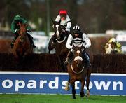 26 December 2001; Moscow Flyer, with Barry Geraghty up, jumps the last ahead of Just Our Job, with Kieran Kelly up, and Colonel Yeager, with Ruby Walsh up, on their way to winning the Denny Gold Medal Novice Steeplechase on Day One of the Leopardstown Christmas Festival at Leopardstown Racecourse in Dublin. Photo by Ray McManus/Sportsfile