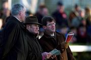 26 December 2001; First Gold owner JP McManus, right, with Frank Berrie, centre, and trainer Joe McKenna watch the King George VI Chase at Kempton on a large screen in the parade ring on Day One of the Leopardstown Christmas Festival at Leopardstown Racecourse in Dublin. Photo by Ray McManus/Sportsfile